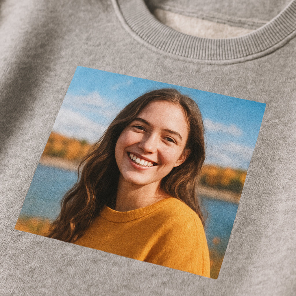 A close‑up of a soft, brushed‑inside sweatshirt fabric with a vibrant photo printed on the chest, showing texture and color detail. Alt: high‑quality personalized photo sweatshirt fabric detail