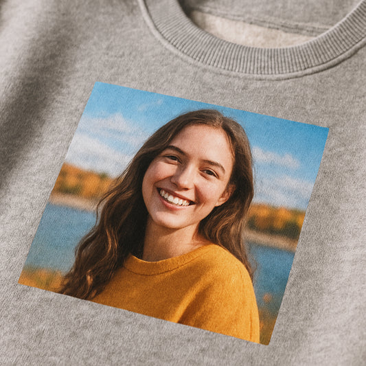A close‑up of a soft, brushed‑inside sweatshirt fabric with a vibrant photo printed on the chest, showing texture and color detail. Alt: high‑quality personalized photo sweatshirt fabric detail