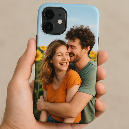 A smartphone with a personalized photo case, showing the back of the phone with a vivid printed photo, bright colors, and a hand holding it. Alt: personalized photo phone case showcasing a cherished memory.